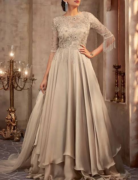 Seamstress stitching an occasion-wear garment